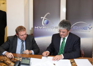 John Paffett of SSTL (left) and Angelo Pieri of Kyprosat (right) sign collaboration agreement
