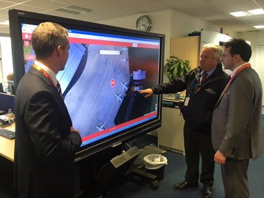 Earth-i CEO, Richard Blain (right) and Farnborough International Head of Operational Development & Health and Safety, Jonathan Smith (middle) use the mapping tool created for Farnborough 2016.
