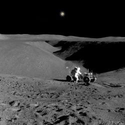Astronaut and lunar buggy on the moon